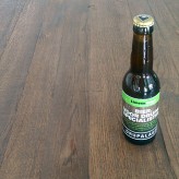 Een flesje Prael bier met een etiket van LimoenGroen
