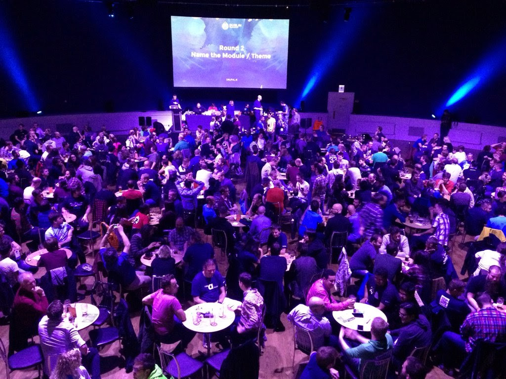 Developers sitting in teams at DrupalCon Pubquiz 